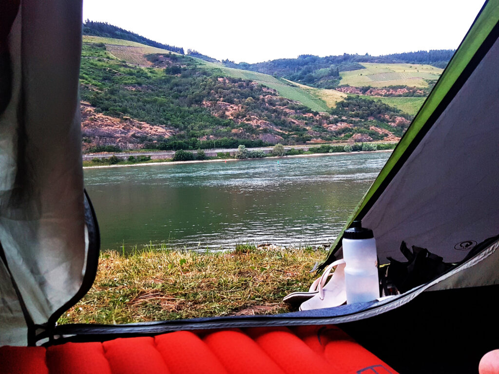 View on the Rhine river from the tent with a hilly background as well